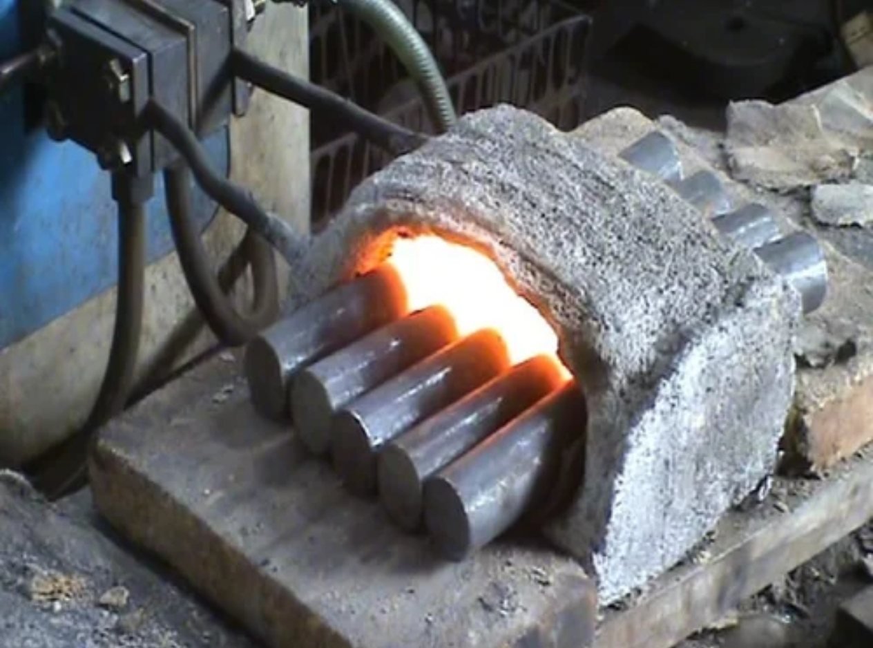 Steel bars glowing during induction heating